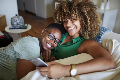 couple cuddling on a couch