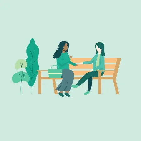 Two people sitting on a bench