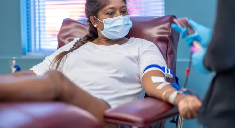latina woman giving blood