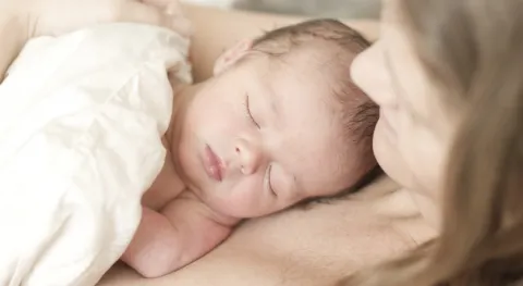 newborn baby laying on mom_Blogcrop
