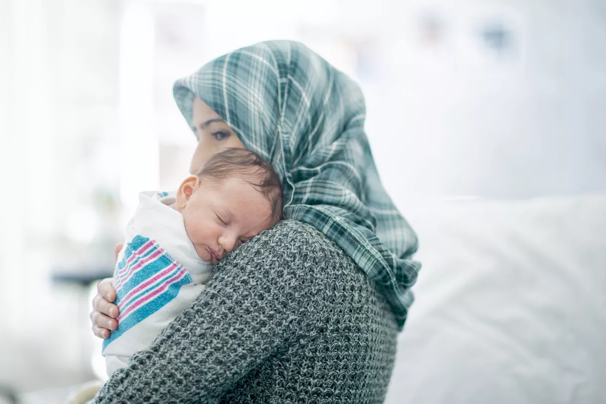 Mother holding newborn baby