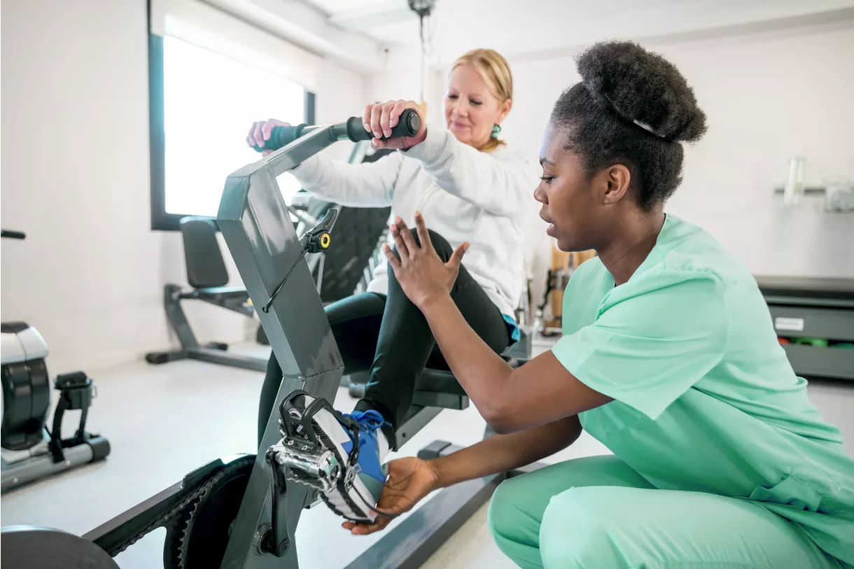 Physical therapist working with client