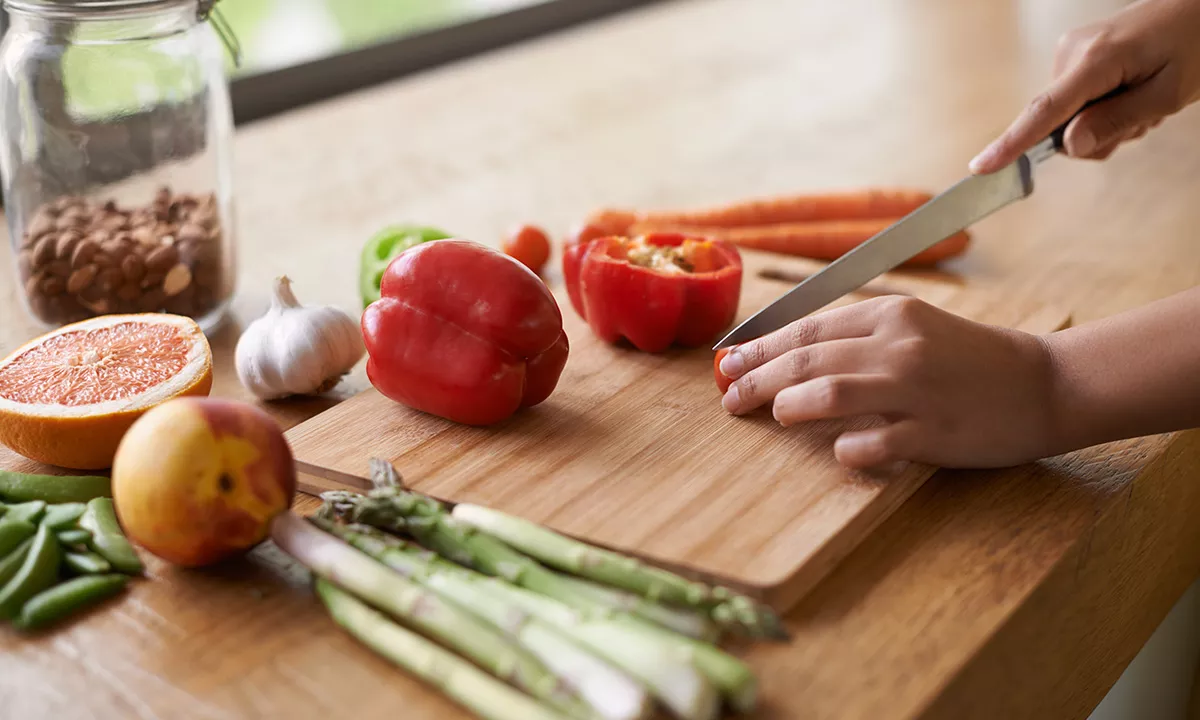 chopping vegetables on a cutting board