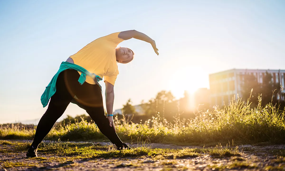 woman warming up stretching outside