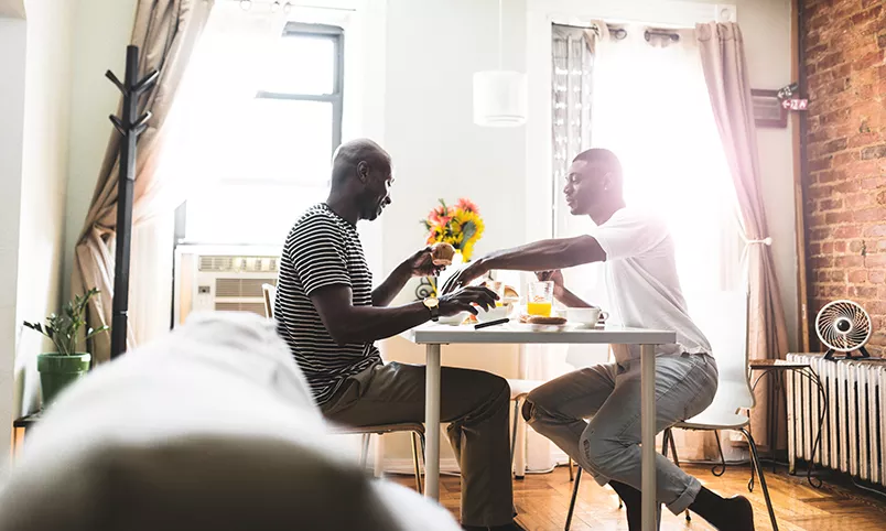 Man helping man nutrition breakfast