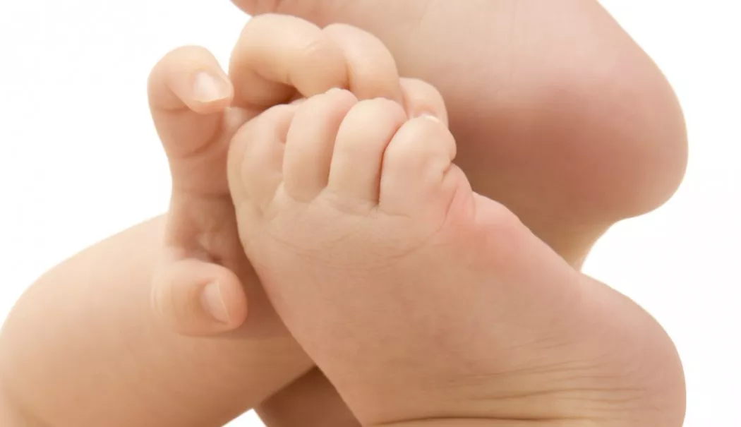 Hands touching feet