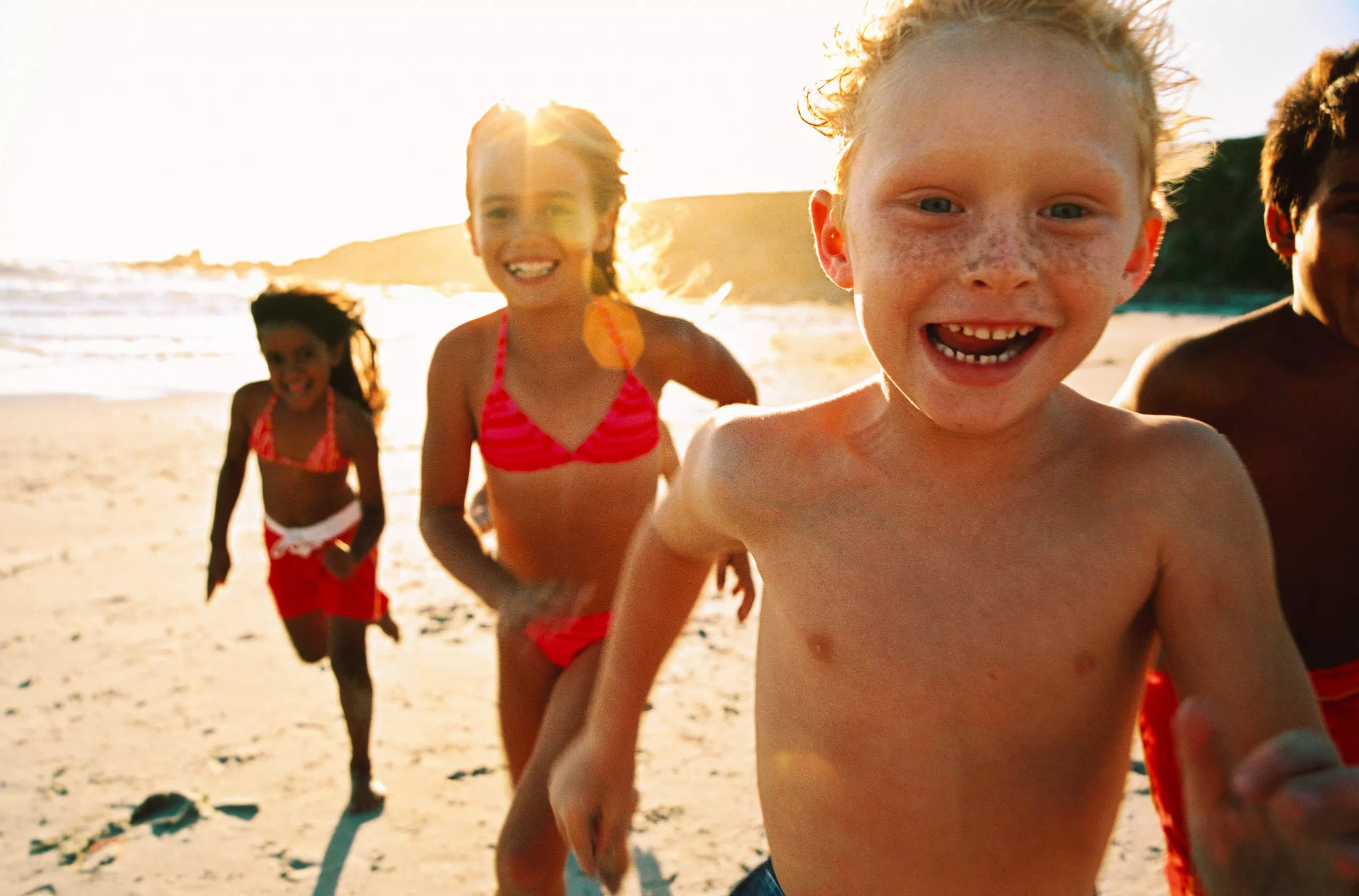 children playing on the beach