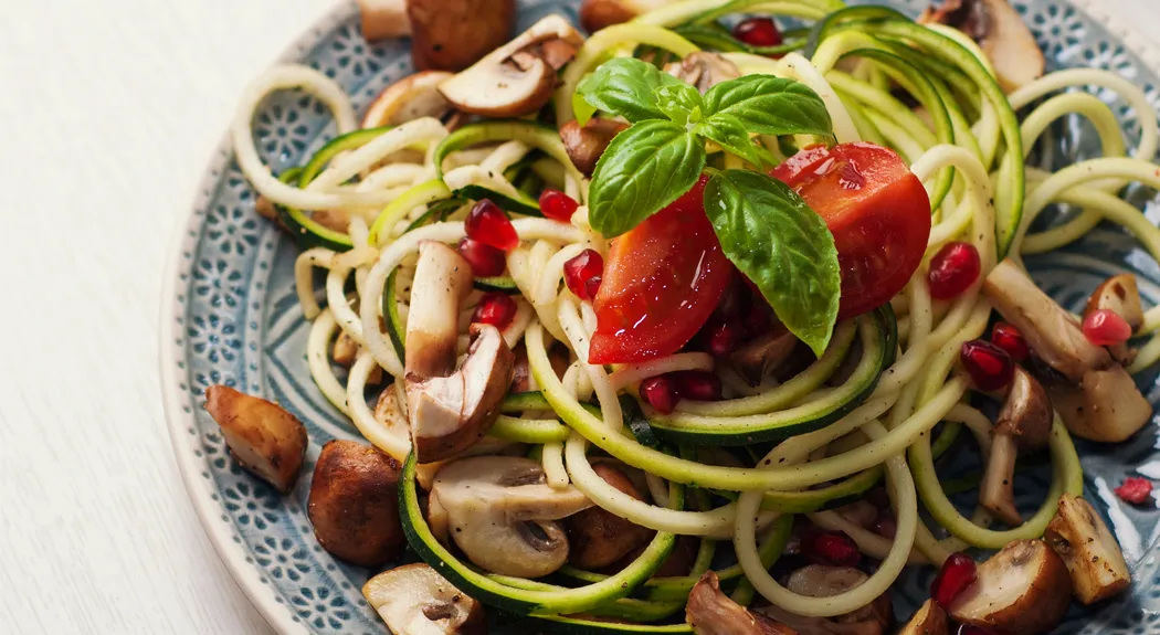 Zoodles with mushrooms and pomegranate seeds