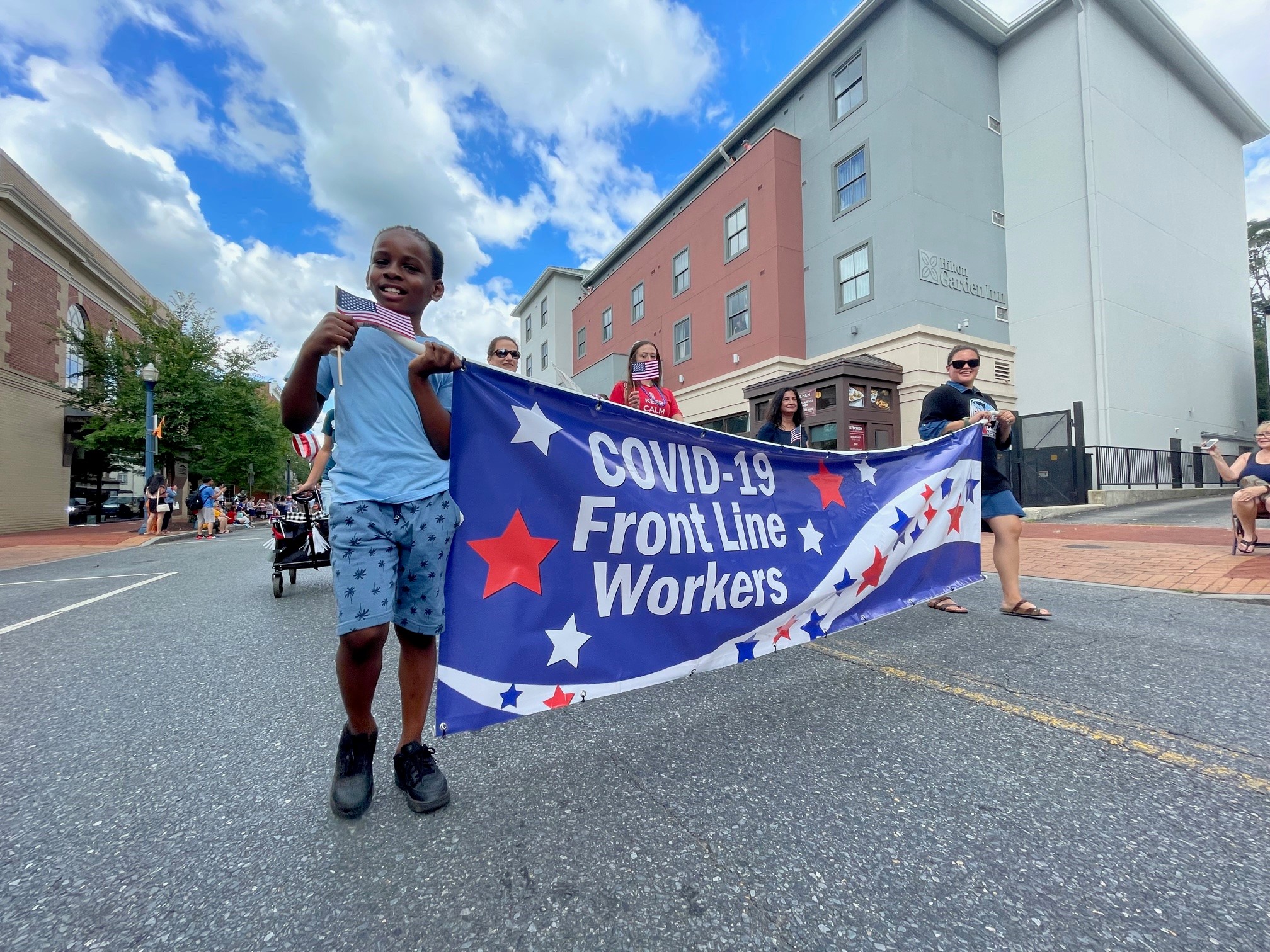 Kid holding the banner during the parade